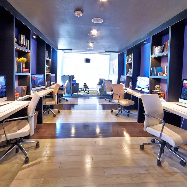 Tech lounge with six individual computer workspaces