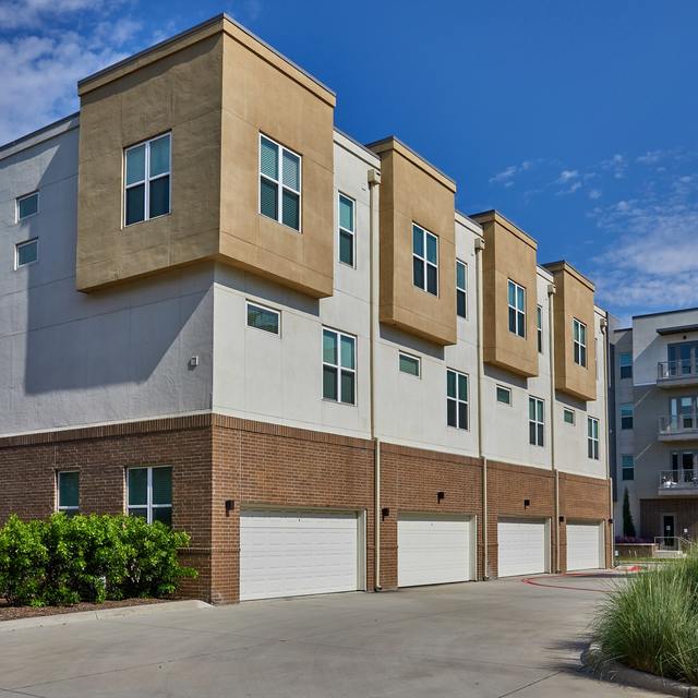 Modern exterior of our Richardson apartments with in-line two car garages