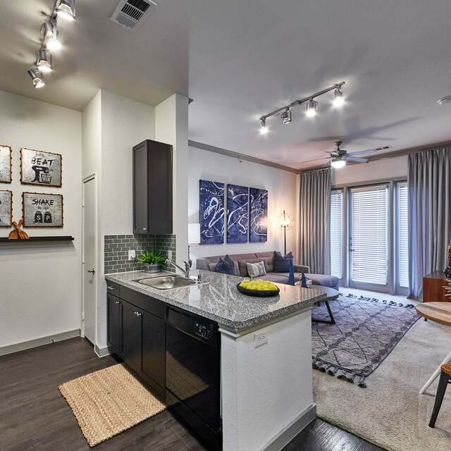 Kitchen area with a breakfast bar at our Richardson, TX apartments