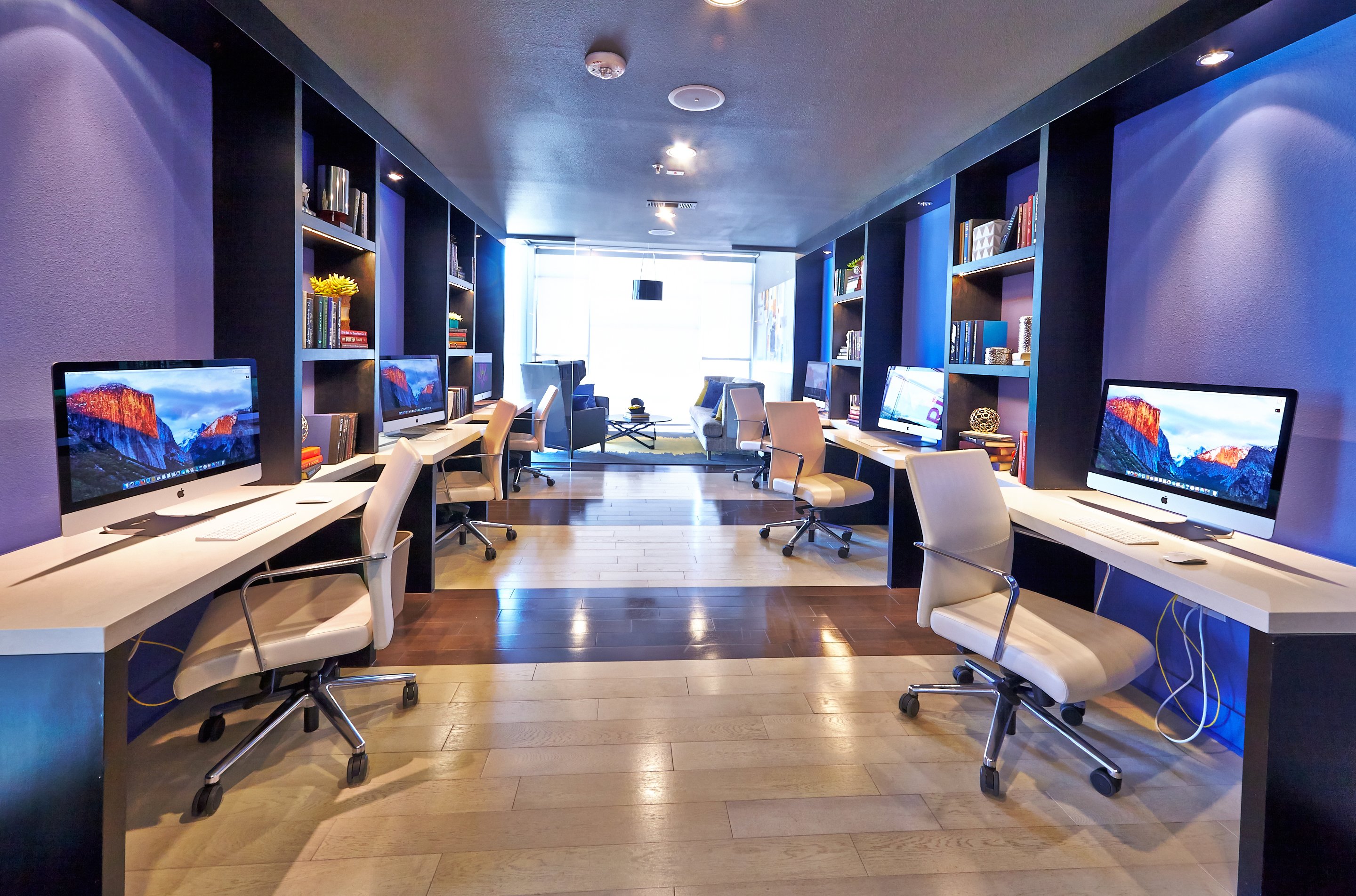 Tech lounge with six individual computer workspaces