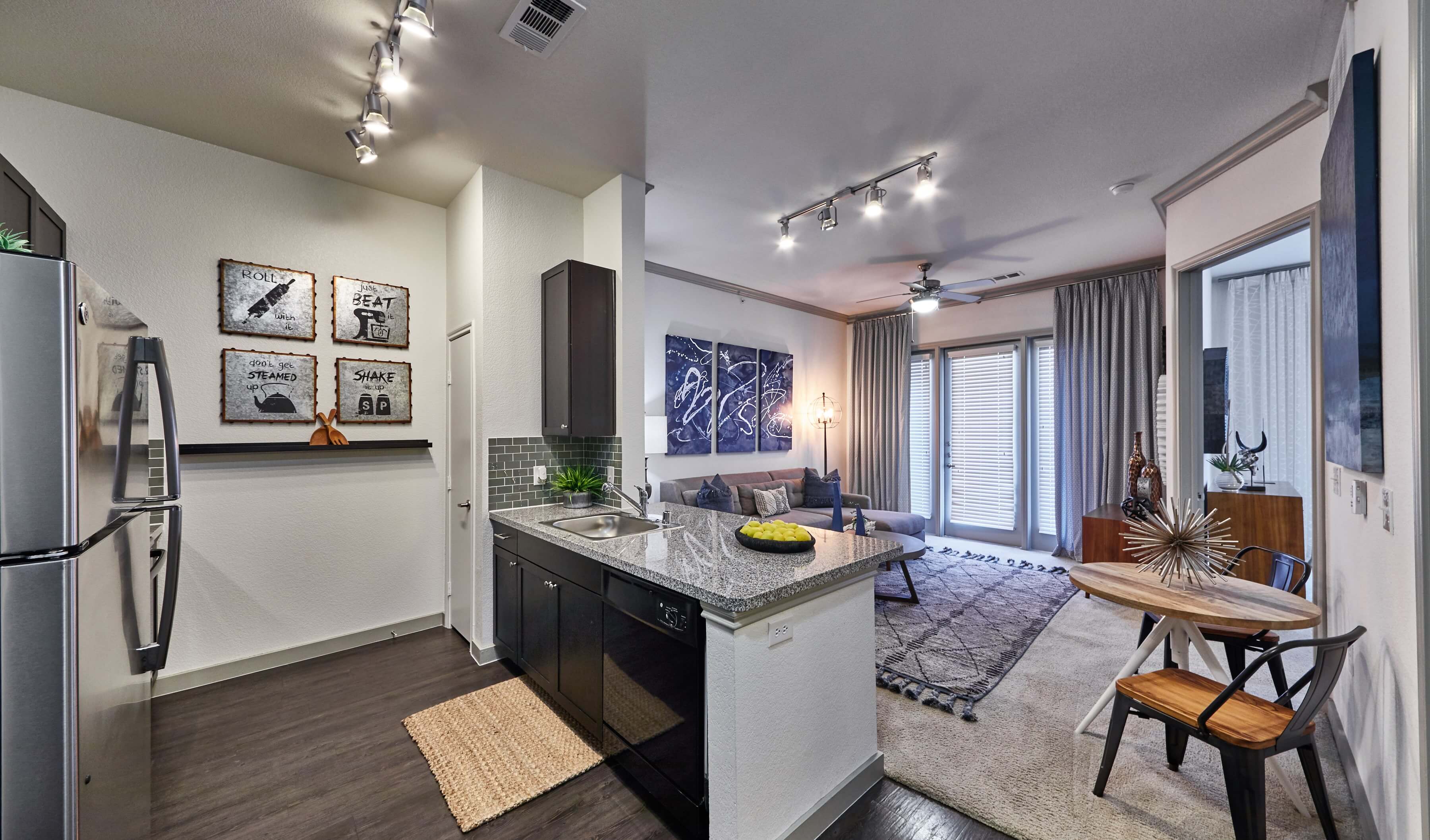 Kitchen area with a breakfast bar at our Richardson, TX apartments