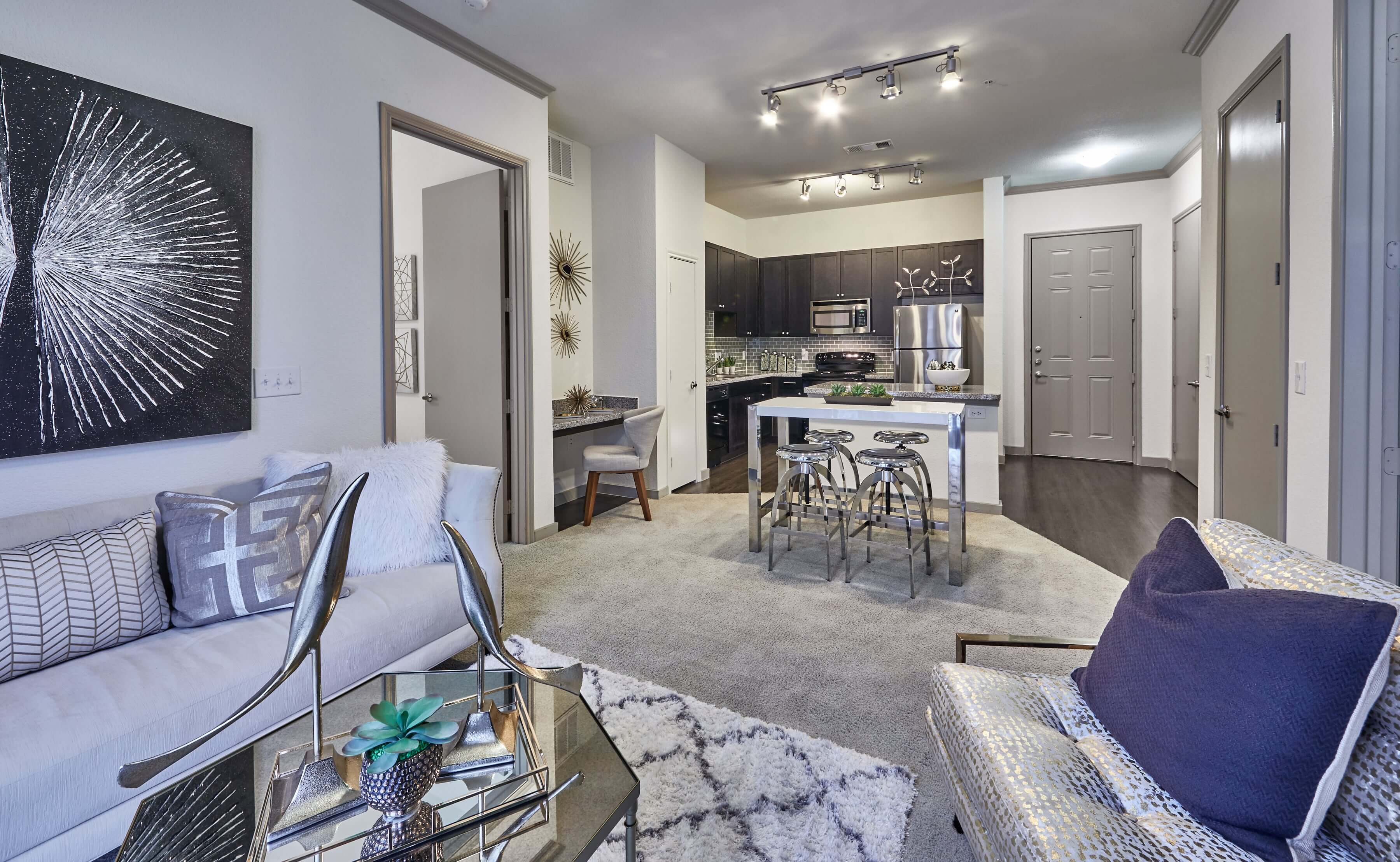 Carpeted living room and dining area