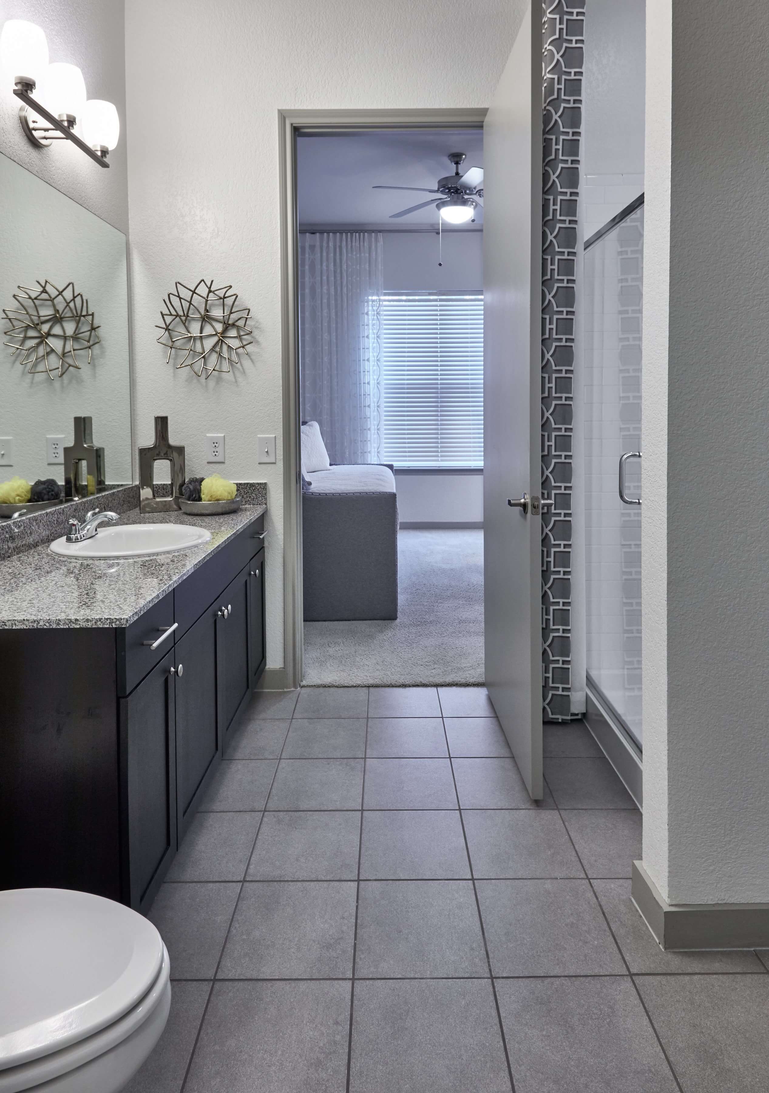 Bathroom with tile flooring and a large single sink vanity